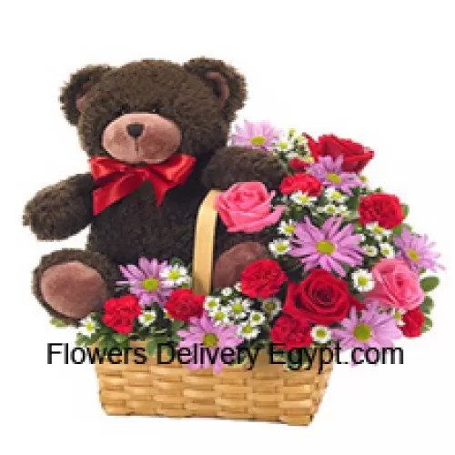 A Beautiful Basket Made Up Of Red And Pink Roses, Red Carnations And Other Assorted Purple Flowers Along With A Cute 14 Inches Tall Teddy Bear