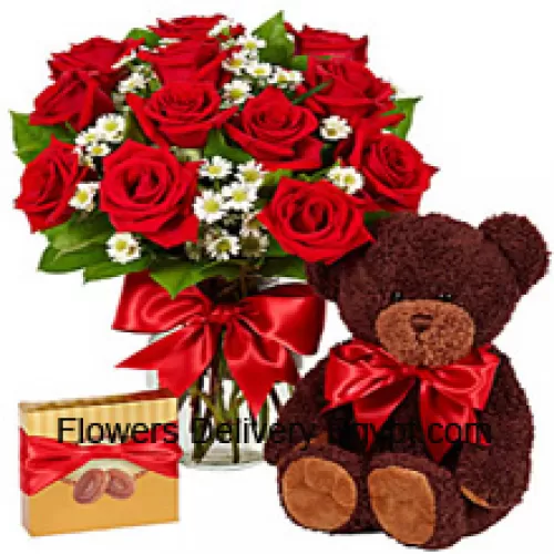 12 Red Roses With Some Ferns In A Glass Vase, A Cute 14 Inches Tall Teddy Bear And An Imported Box Of Chocolates