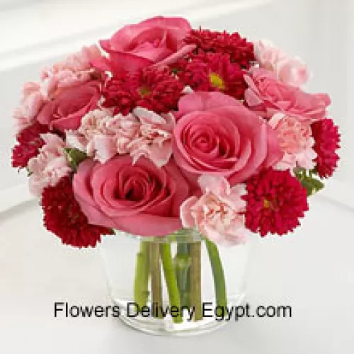 6 Pink Roses, 10 Red Colored Daisies And 10 Pink Colored Carnations In A Glass Vase