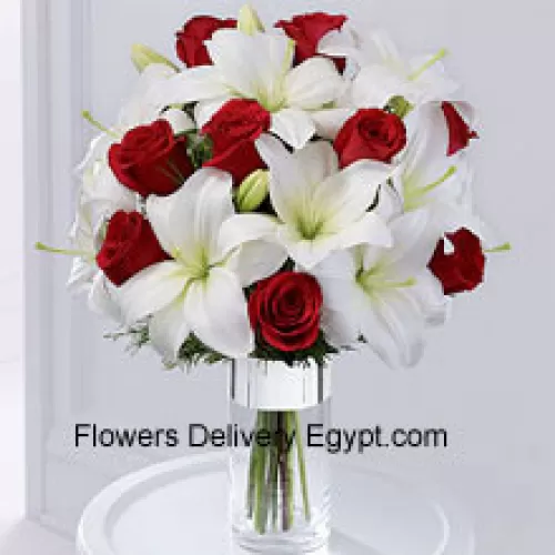 This product is a sleek and elegant way to spread goodwill for the holiday season. Red roses are set to catch the eye arranged amongst white Oriental lilies in a clear glass cylinder vase wrapped in silver ribbon to create a seasonal display of heartfelt wishes for a magical holiday. (Please Note That We Reserve The Right To Substitute Any Product With A Suitable Product Of Equal Value In Case Of Non-Availability Of A Certain Product)
